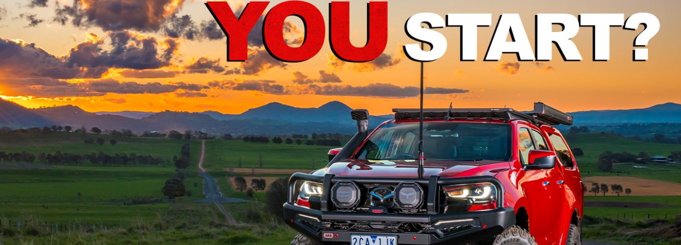 4WD touring vehicle fitted with a bull bar, suspension upgrades and roof rack setup
