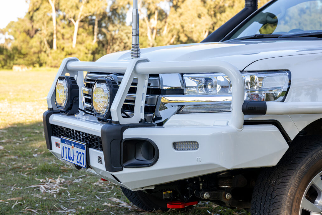 Close-up of the ARB Summit bull bar and Night Hawk driving lights fitted to a Toyota LandCruiser 200 Series.