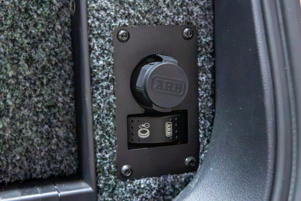 ARB on-board twin compressor controls and air outlet integrated into the rear drawer system of a Toyota LandCruiser 300 Series.