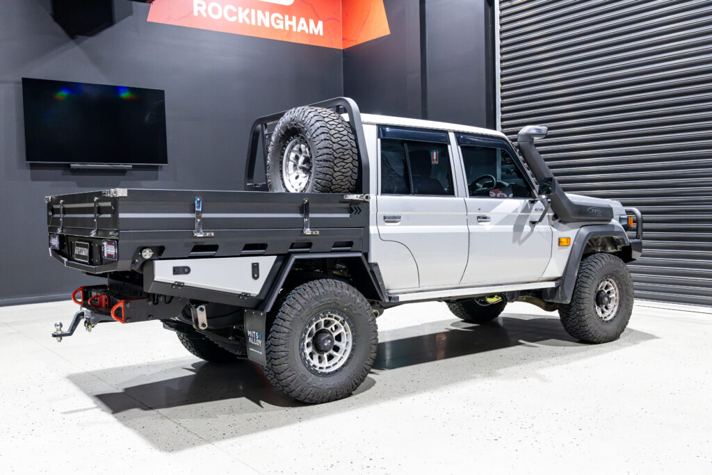 Rear three quarter view of a Toyota LandCruiser 79 Series fitted with a MITS Alloy tray, undertray toolboxes and recovery points.