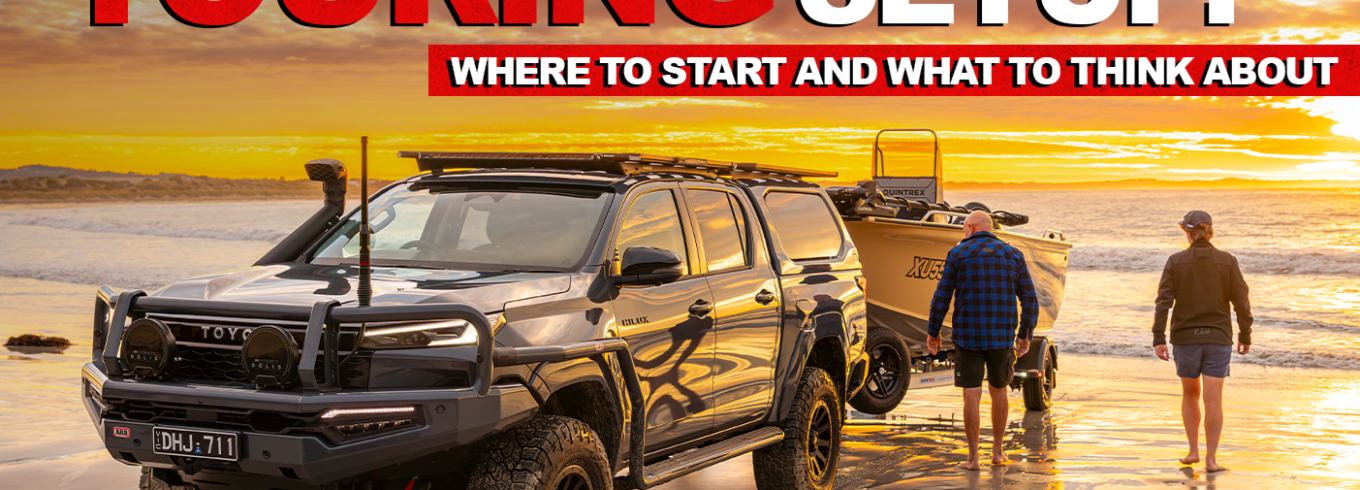 Toyota Hilux touring setup parked on a WA beach ready for camping and boating