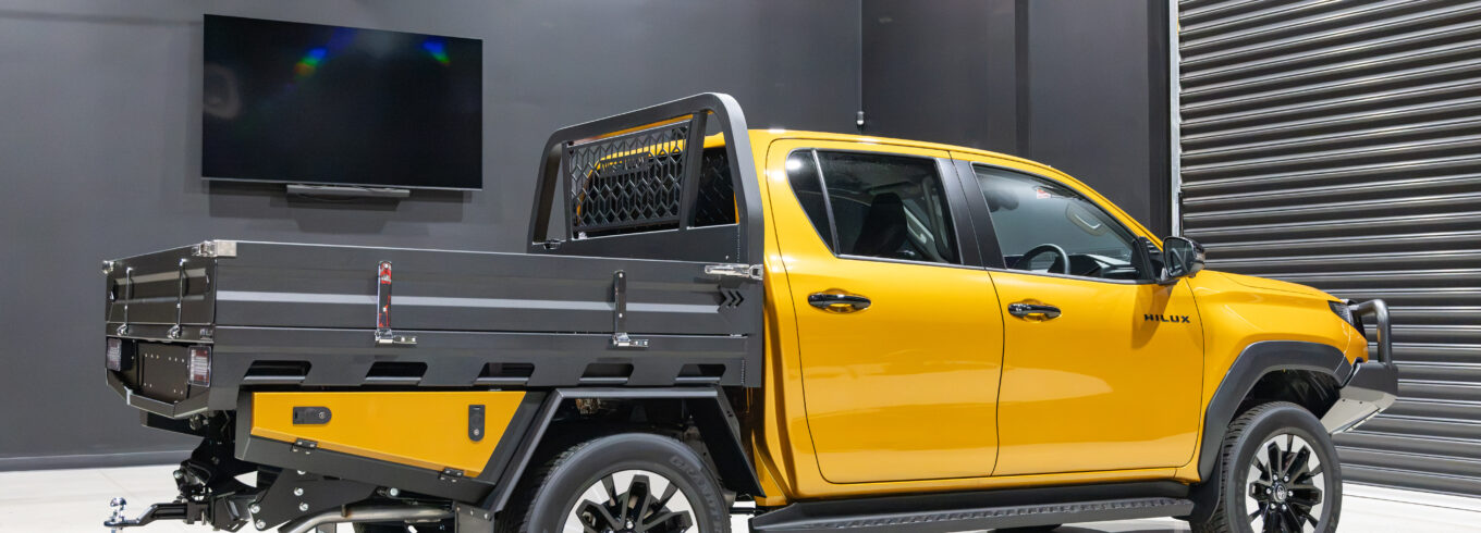 Rear three quarter view of an N90 Toyota HiLux with a MITS Alloy tray, sideboards and undertray toolboxes