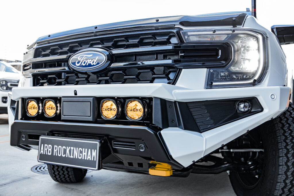Close-up of a white Ford Everest fitted with an ARB Zenith Bull Bar, ARB Nacho lights and rated recovery points