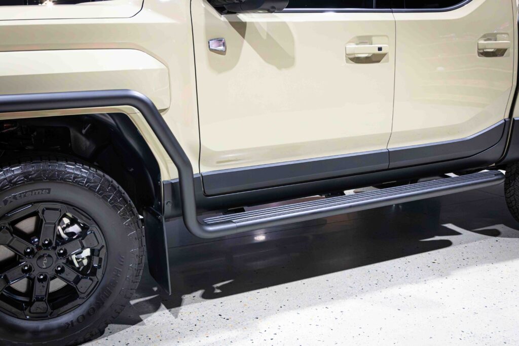 Kia Tasman fitted with ARB side rails and steps as part of a complete 4WD setup
