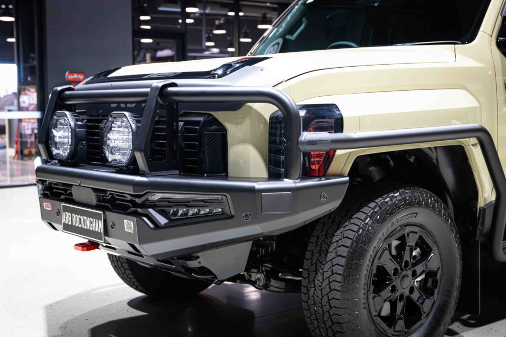 Kia Tasman fitted with an ARB Summit MKII Bull Bar, side rails, steps and Bushranger Night Hawk driving lights