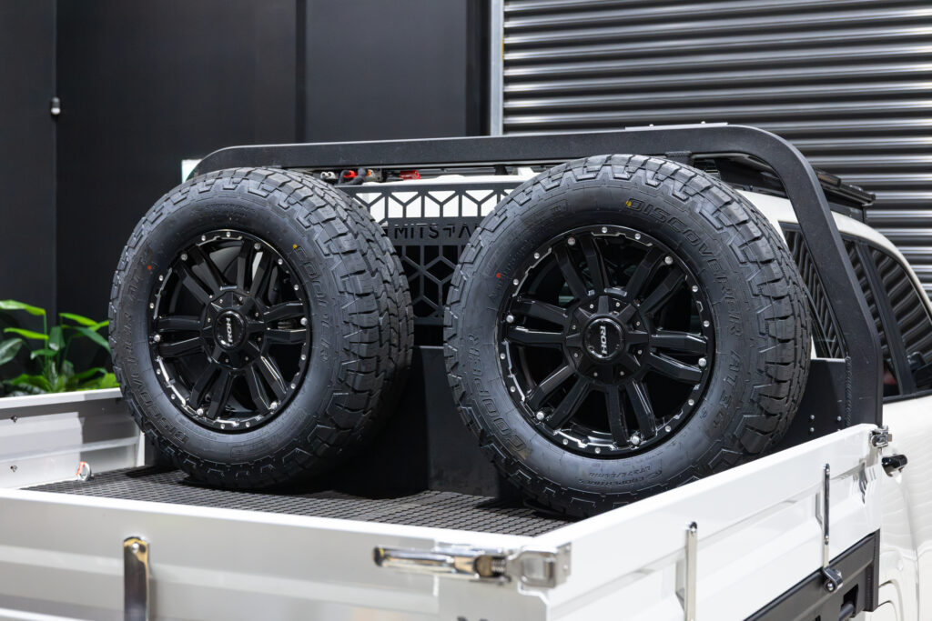 Twin spare wheels mounted behind the cab on Tania’s chopped Toyota LC300 MITS Alloy tray build