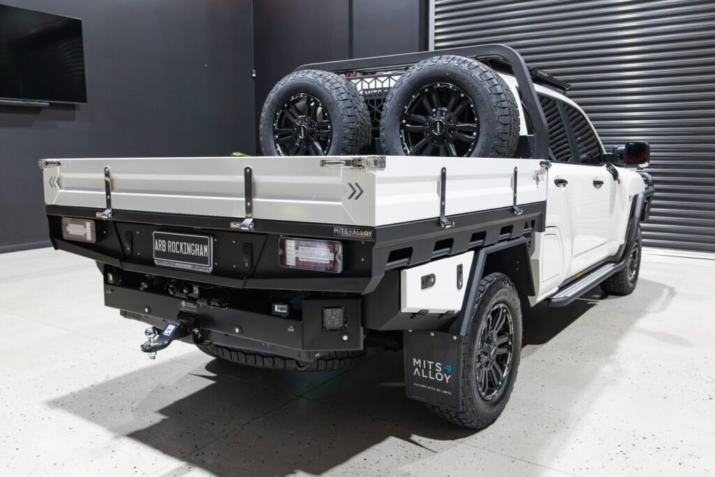 Rear view of Tania’s chopped Toyota LC300 with MITS Alloy tray, colour coded sideboards and undertray storage
