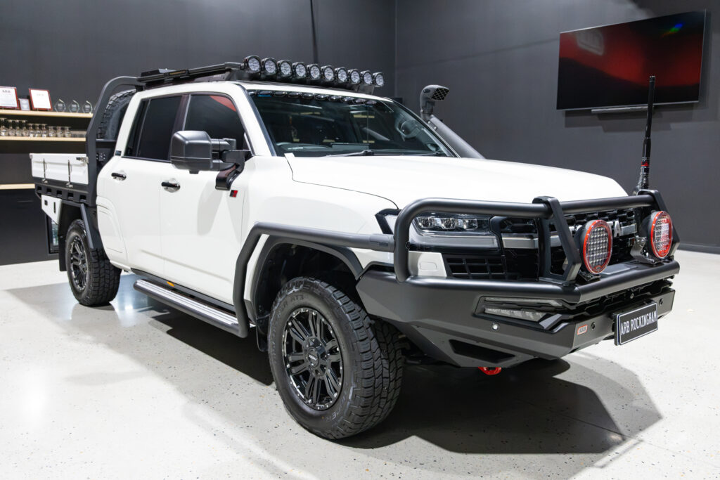 Front three-quarter view of Tania’s chopped Toyota LC300 with MITS Alloy tray, ARB Summit MKII Bull Bar, Intensity driving lights, Safari snorkel and roof lights