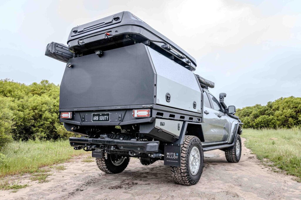 Rear three-quarter view of a Ford Super Duty MITS Alloy tray and canopy touring setup