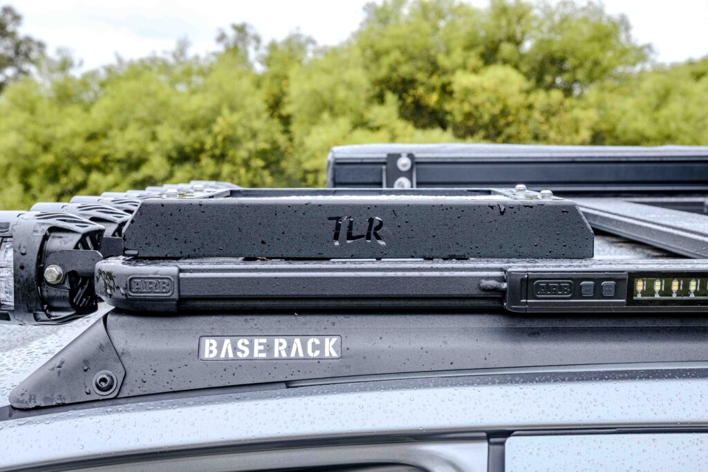 Close-up of the ARB Base Rack and TLR accessory mount fitted to the roof of a Ford Super Duty