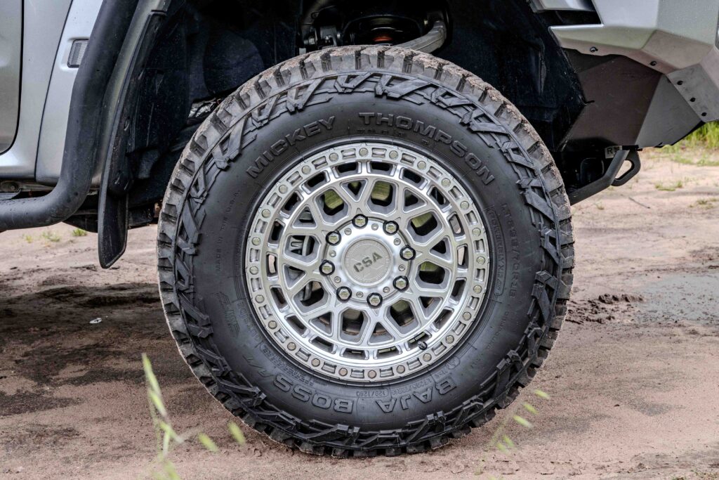 Close-up of the wheel and all-terrain tyre on a Ford Super Duty touring build