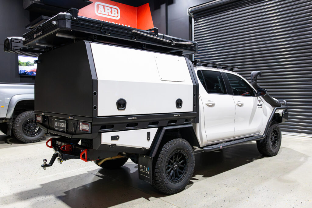Toyota Hilux with colour coded MITS Alloy tray and canopy, undertray toolboxes, rooftop tent and Hayman Reese X-Bar