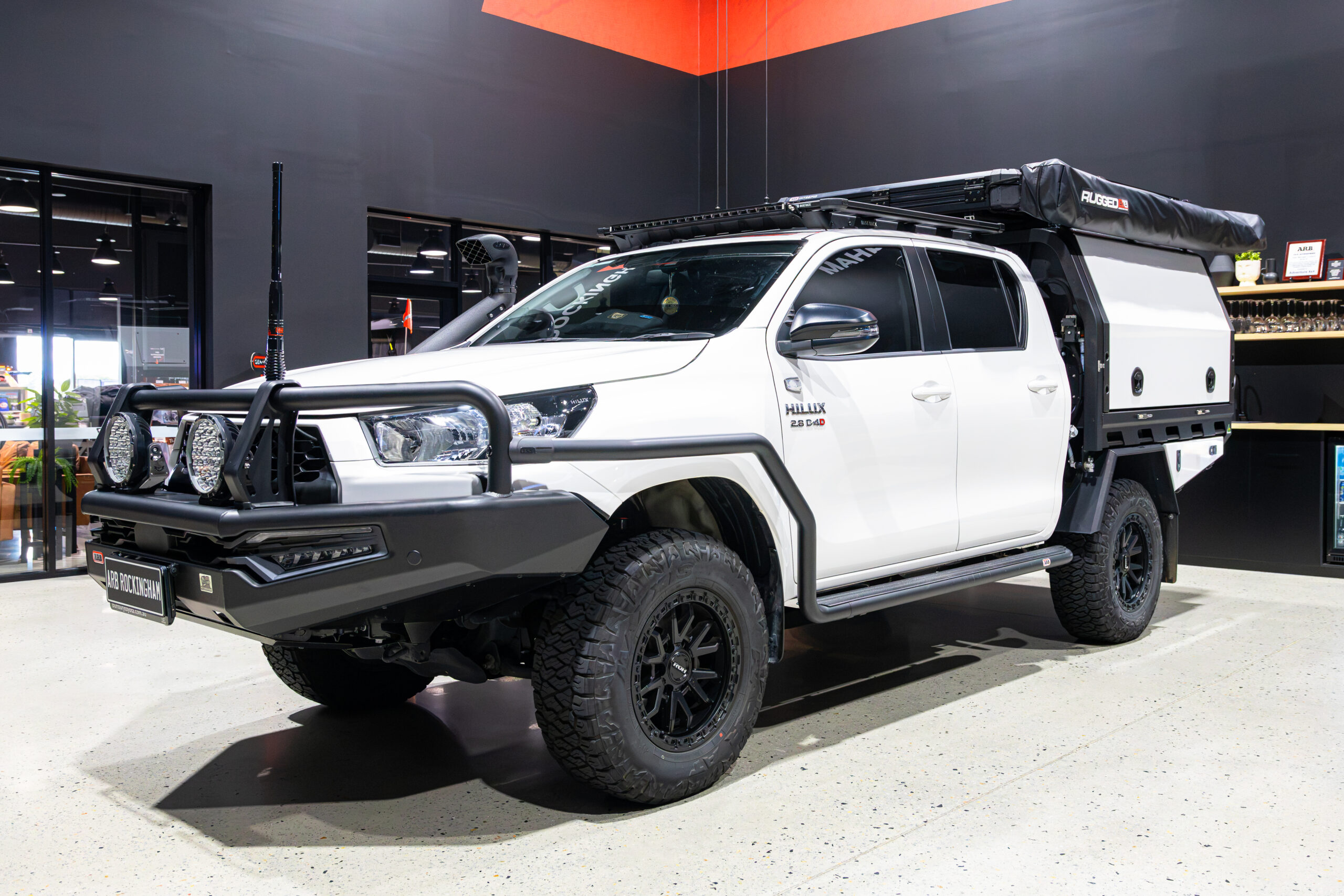Front three-quarter view of Michael’s Toyota Hilux with ARB bull bar, side rails, driving lights, snorkel and MITS Alloy canopy