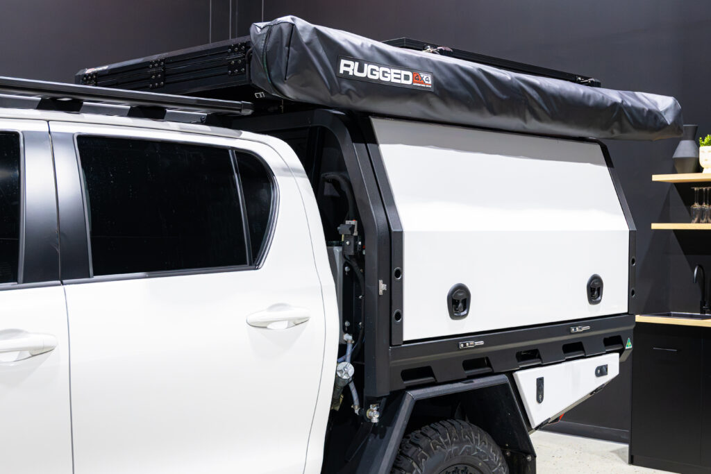 MITS Alloy canopy fitted to a Toyota Hilux with colour coded doors, undertray toolbox and side-mounted awning