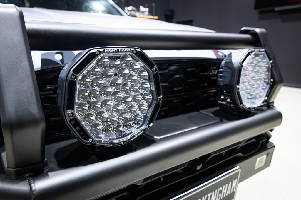 Close-up of Bushranger Night Hawk 9 inch ADV driving lights fitted to an ARB Summit MKII Bull Bar on an Isuzu MU-X