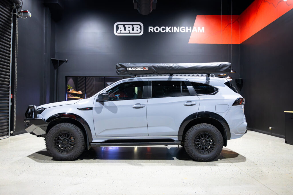 Side view of Liam’s Isuzu MU-X fitted with a Rhino-Rack Backbone and three Rhino-Rack Sportz Bars