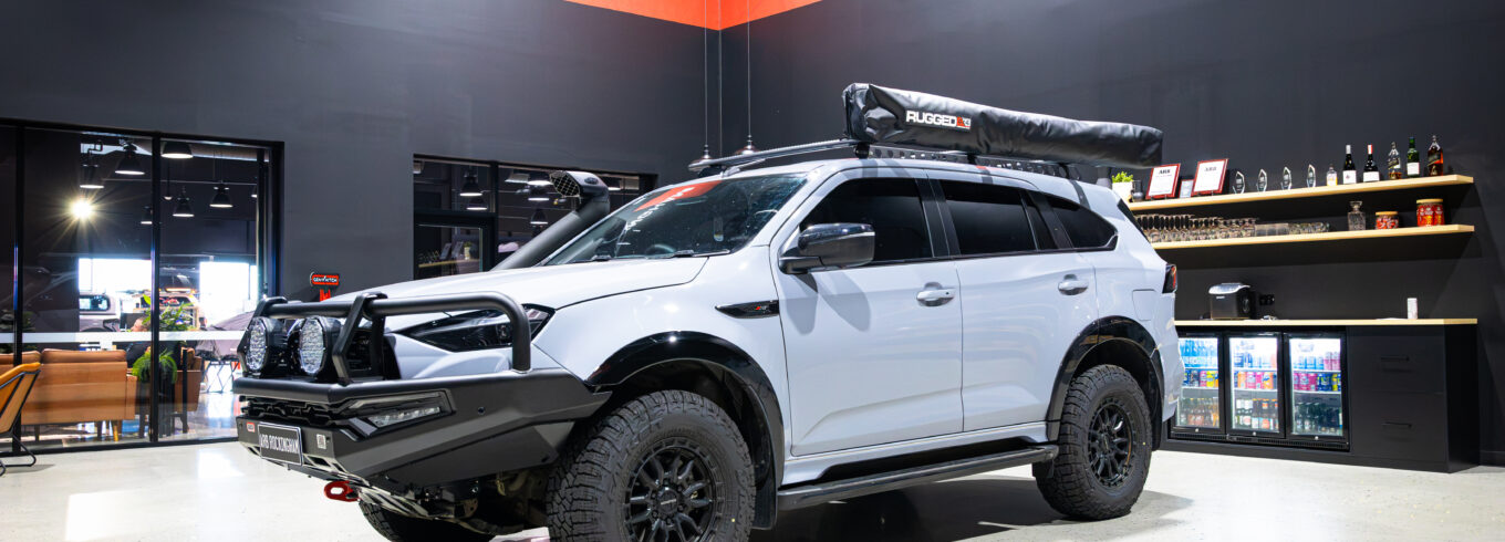 Front three-quarter view of Liam’s Isuzu MU-X with ARB Summit MKII Bull Bar, Night Hawk driving lights and Safari ARMAX snorkel
