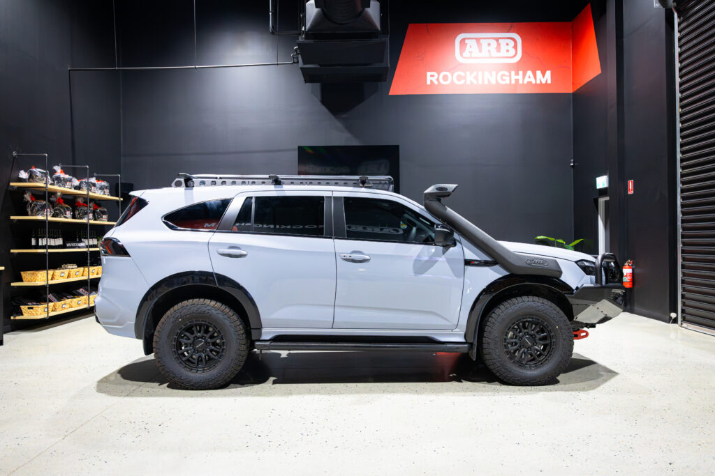 Side profile of Liam’s Isuzu MU-X with ARB bull bar, Safari snorkel and Rhino-Rack roof setup inside ARB Rockingham
